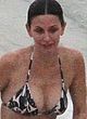 Courteney Cox naked pics - tanning in bikini on a beach