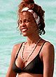 Whitney Houston sunbathes in bikini on a beach pics