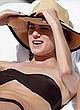 Allison Williams sunbathing in black bikini pics