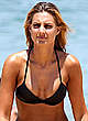 Laura Dundovic in black bikini on bondi beach pics