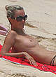 Laeticia Hallyday sunbathing topless on a beach pics