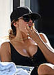 Larsa Pippen in black swimsuit by the pool pics