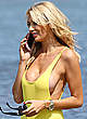 Olivia Attwood in yellow swimsuit on a beach pics