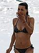 Julia Jones wearing a bikini on a beach pics