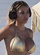 Maria Hering busty in a gold thong bikini pics