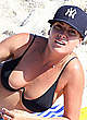 Lisa Clark in black bikini on a beach pics