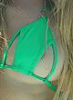 Avril Lavigne naked pics - nip slip in a green bikini