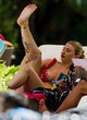 Olivia Buckland flashing boob by the pool pics