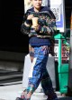 Millie Bobby Brown in sweater and plaid pants pics