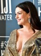 Anne Hathaway wows in revealing gold dress pics