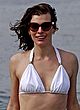 Milla Jovovich tanning in white bikini pics