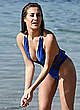 Chloe Goodman in blue swimsuit on a beach pics