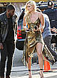 Lindsey Vonn posing in gold dress pics