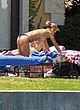 Anna Kournikova flashing tits in backyard pics