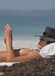 Ashley Hart sunbathing topless on beach pics