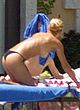 Anna Kournikova sunbathing topless in backyard pics