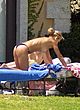 Anna Kournikova sunbathing topless in backyard pics