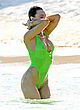 Joy Corrigan visible tits in green swimsuit pics