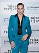Hailee Steinfeld posing in a teal suede suit pics