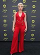 Florence Pugh posing in a red jumpsuit pics