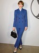 Emma Stone posing in a chic blue pantsuit pics
