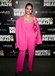Selena Gomez shows bust in pink pantsuit pics