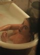 Lily James shows tits in bathtub scene pics