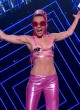 Miley Cyrus almost visible tits on stage pics