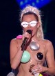 Miley Cyrus visible side-boob on the stage pics