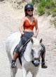 Emma Watson carefree horseback riding pics