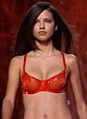 Adriana Lima flashes in red lingerie pics