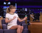 Taylor Swift stuns in a white mini dress videos